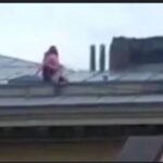 Raunchy couple risk their lives to have done this on the rooftop public on a sloped rooftop of four-storey building