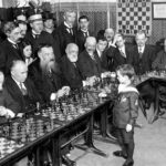 In 1920, eight-year-old Samuel Reshevsky stunned the chess world by defeating multiple chess masters simultaneously in France, showcasing an extraordinary level of skill and intellect for his age.