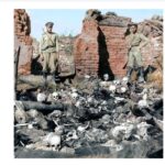 Russian soldiers standing over the remains of Armenians burned by Ottoman forces in the Anatolian village of Sheikhalan, 1915.