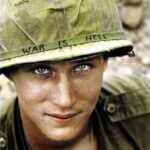 The iconic image of a U.S. soldier with the phrase “WAR IS HELL” emblazoned on his helmet dates back to 1965, capturing the raw emotions and harsh realities faced by young men during the Vietnam War.