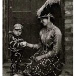 Pearly Queen and Pearly Prince, London, 1926-1927. Cockney ‘Pearly kings’ (originally costermongers – fruit and vegetable sellers), wore suits covered in mother-of-pearl buttons.