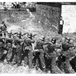 1944 – Defiant French Resistance member Georges Blind smiling in front of a German execution squad