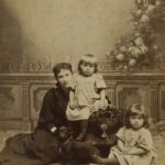 Around 1894, Zofia Grodzicka is photographed with her two daughters, Wanda and Aleksandra, and their dog Radom in Poland.