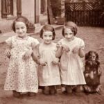 In 1930, a group of four young ladies gathers for a photograph, capturing a moment of youthful camaraderie and style during an era of significant change.